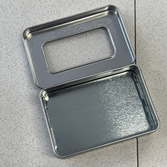 Metal tin with viewing window